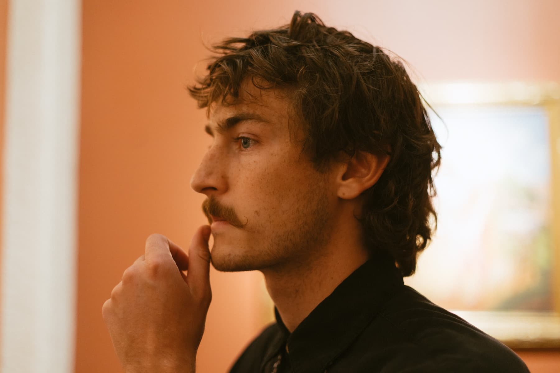 Profile portrait in warm gallery light